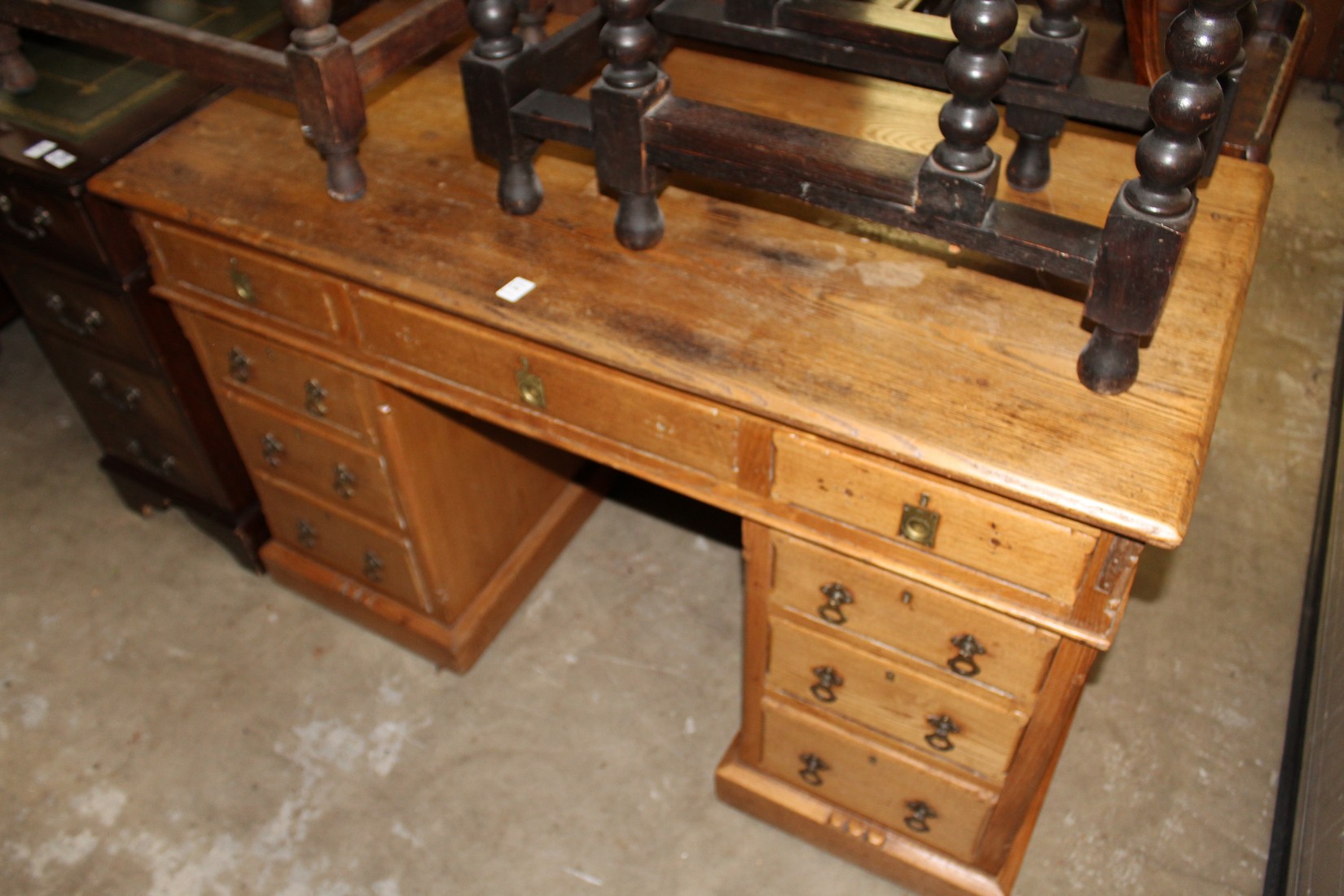 A Victorian ash pedestal desk.