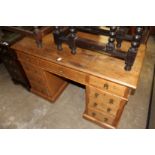 A Victorian ash pedestal desk.