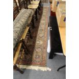A good large Persian carpet, green ground with floral decoration.