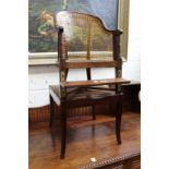 A 19th century mahogany child's Bergere style high chair.