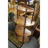 A Victorian inlaid walnut four tier what-not.