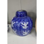 A Chinese blue and white ginger jar and cover, decorated with geese.