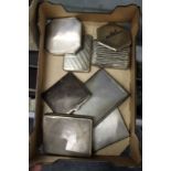 A collection of silver cigarette cases and compacts.