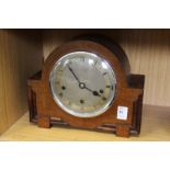 An oak mantle clock.