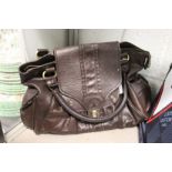 A ladies' brown leather handbag.