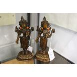A pair of eastern bronze deities inset with coral.