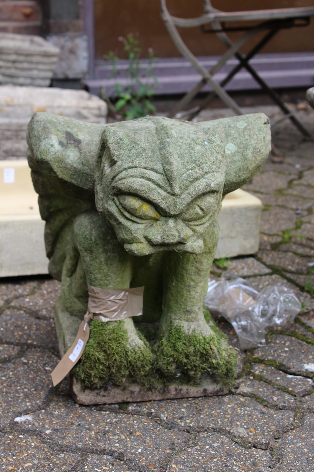 A large garden ornament modelled as a gargoyle.