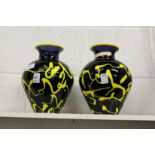 A pair of colourful studio glass vases.