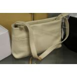 A Radley beige leather handbag with dust cover.