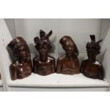 Four good carved hardwood Indonesian busts.