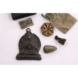 A Tibetan bronze pendant on stand and various other items.