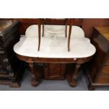 A Victorian mahogany and marble top wash stand the ornate base with cupboard.