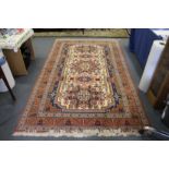 A Persian design carpet, cream ground with stylized decoration.