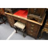 A Victorian walnut pedestal desk.