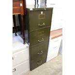 An old metal four drawer filing cabinet and modern two drawer filing cabinet.