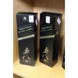 Two bottles of Johnnie Walker Black Label whisky, boxed.