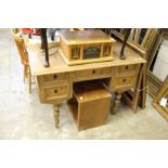 A continental pine kneehole desk.