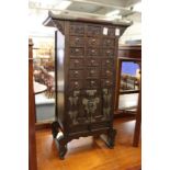 A Chinese multi-drawer table-top cabinet / chest.