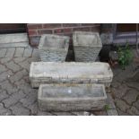 A pair reconstituted stone garden planters and two similar garden troughs.