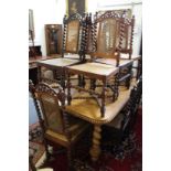A set of twelve Indian hardwood dining chairs, two with arms, all with canework backs and seats,