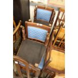 A set of four Victorian walnut and upholstered dining chairs.