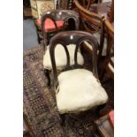 A pair of Victorian mahogany dining chairs.