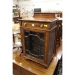 An Edwardian inlaid mahogany small cabinet.