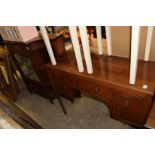 A walnut sideboard and a Victorian rosewood side cabinet.