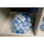 A bag of fifty mixed golf balls.