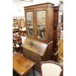 A good George III bureau bookcase, the upper section with pair of mirrored doors over a fall flap,