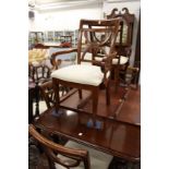 A set of eight mahogany dining chairs, two with arms.