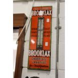 Brooklax, an enamel advertising sign with thermometer (lacking tube).
