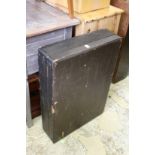 A large leather cloth covered storage box.