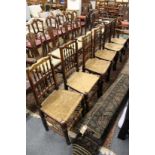 Six 19th century Lancashire spindle back and rush seated dining chairs.