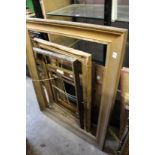 A quantity of picture frames.