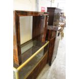 An unusual glass console table and a pair of matching cabinets.