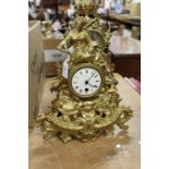 An ornate gilt spelter mantle clock.