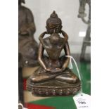 A small bronze erotic couple.