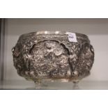 A good Indian white metal repousse bowl, tests as silver, decorated with panels of dancing figures