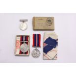 Two WWII medals with ribbons and original box etc.