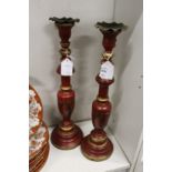 A pair of decorative turned wood candlesticks.