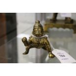 A small bronze figure of baby Krishna.