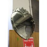 A heart shaped Venetian style mirror.