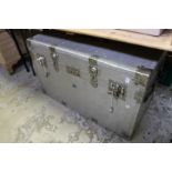 A large aluminium storage trunk.