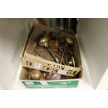 Two boxes of brass and other door furniture.