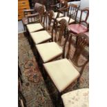 A set of four mahogany shield back dining chairs.