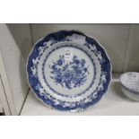 A Chinese blue and white plate (repaired).