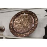 A good large Arts & Crafts circular copper dish with embossed decoration.