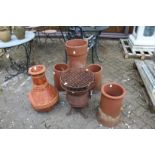 A chimenea, terracotta chimney pots and cast iron stove.