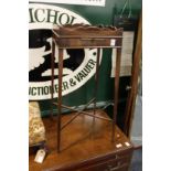 A George III style mahogany urn stand.